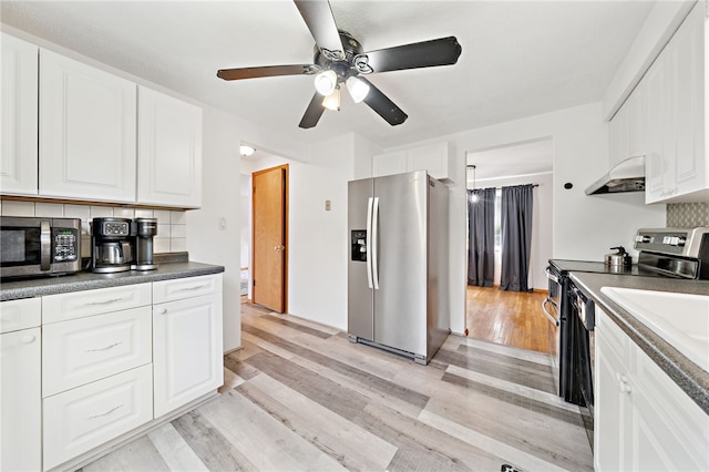 1541 Sugarloaf, Plum Boro, PA 15239 - kitchen featuring stainless steel appliances, ceiling fan, backsplash, and light wood-style flooring