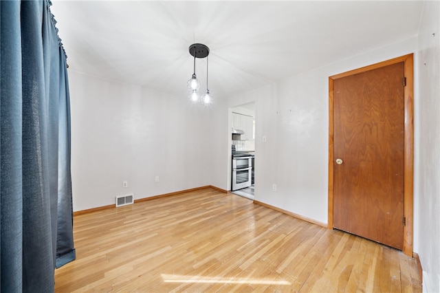 1541 Sugarloaf, Plum Boro, PA 15239 - unfurnished living room featuring light wood-type flooring and baseboards