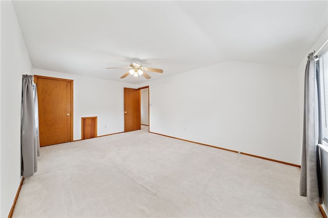 1541 Sugarloaf, Plum Boro, PA 15239 - unfurnished bedroom with vaulted ceiling, light carpet, and a ceiling fan