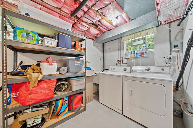 1541 Sugarloaf, Plum Boro, PA 15239 - washroom with washing machine and dryer and concrete block wall