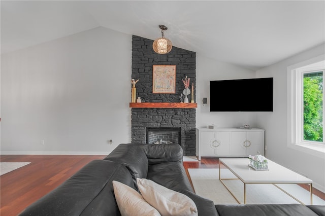 231 Loretta Dr, Monroeville, PA 15146 - living area with vaulted ceiling, a stone fireplace, and wood finished floors