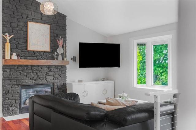 231 Loretta Dr, Monroeville, PA 15146 - living room featuring lofted ceiling, a stone fireplace, and wood finished floors