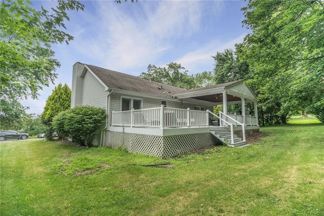 231 Loretta Dr, Monroeville, PA 15146 - back of property featuring a chimney, a yard, a deck, and a shingled roof