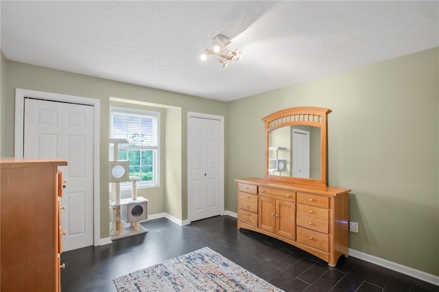 231 Loretta Dr, Monroeville, PA 15146 - foyer entrance with dark wood-type flooring and a textured ceiling