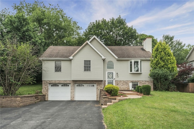 231 Loretta Dr, Monroeville, PA 15146 - bi-level home with driveway, a garage, a chimney, a front lawn, and a shingled roof