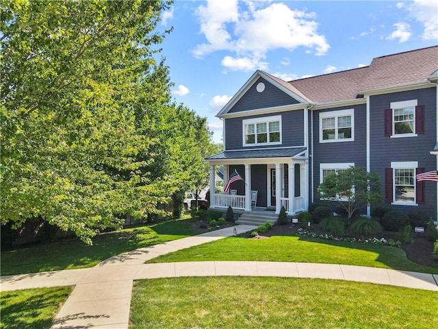 1 Riverfront St, Oakmont, PA 15139 - view of front facade with a porch and a front lawn