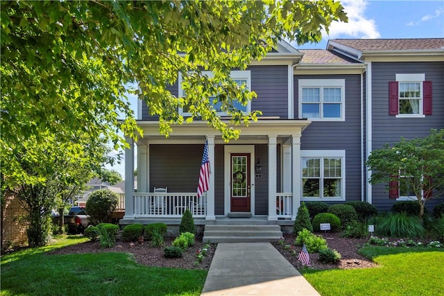 1 Riverfront St, Oakmont, PA 15139 - view of front facade with a porch and a front lawn