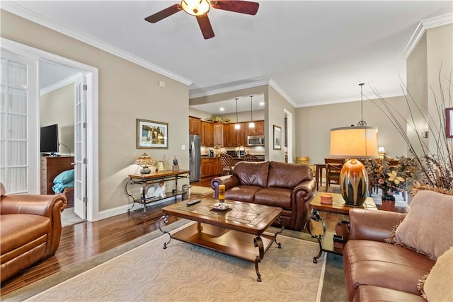 1 Riverfront St, Oakmont, PA 15139 - living area featuring wood finished floors, a ceiling fan, and crown molding