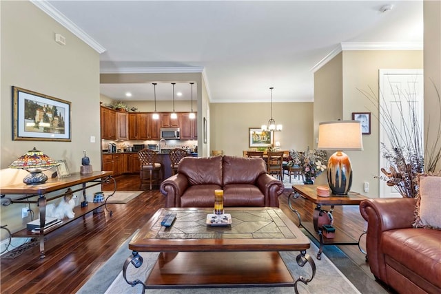 1 Riverfront St, Oakmont, PA 15139 - living area with dark wood finished floors, ornamental molding, and a chandelier