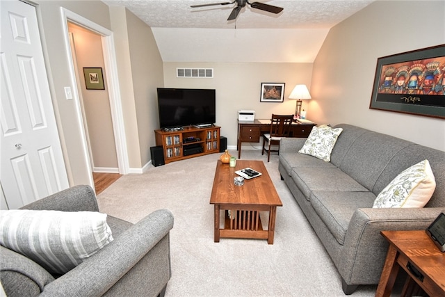 121 Sedeca Dr, North Strabane, PA 15317 - living area featuring ceiling fan, carpet floors, vaulted ceiling, and a textured ceiling