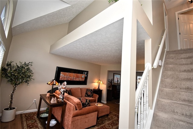 121 Sedeca Dr, North Strabane, PA 15317 - living area with wood finished floors, stairway, and a textured ceiling