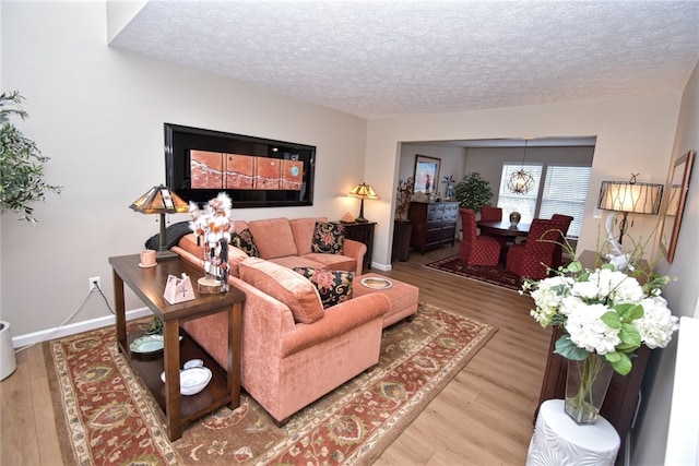 121 Sedeca Dr, North Strabane, PA 15317 - living area with a textured ceiling and wood finished floors