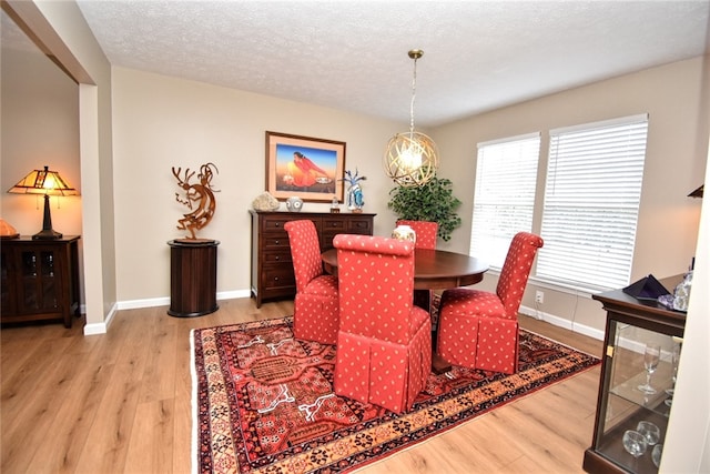 121 Sedeca Dr, North Strabane, PA 15317 - dining area featuring wood finished floors and a textured ceiling
