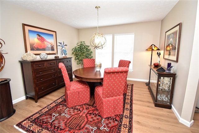 121 Sedeca Dr, North Strabane, PA 15317 - dining area with light wood-type flooring and a chandelier