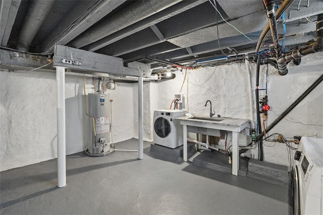5110 Duncan St, Lawrenceville, PA 15201 - unfinished basement featuring washer / dryer and gas water heater