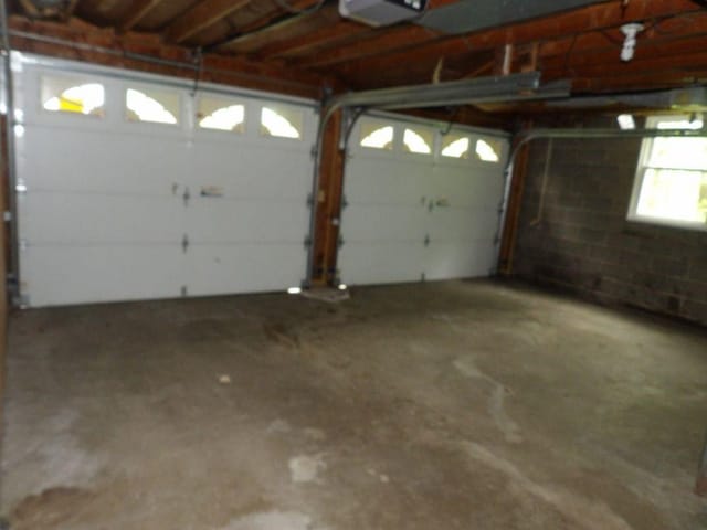 319 Robin Dr, Franklin, PA 16323 - garage featuring a garage door opener