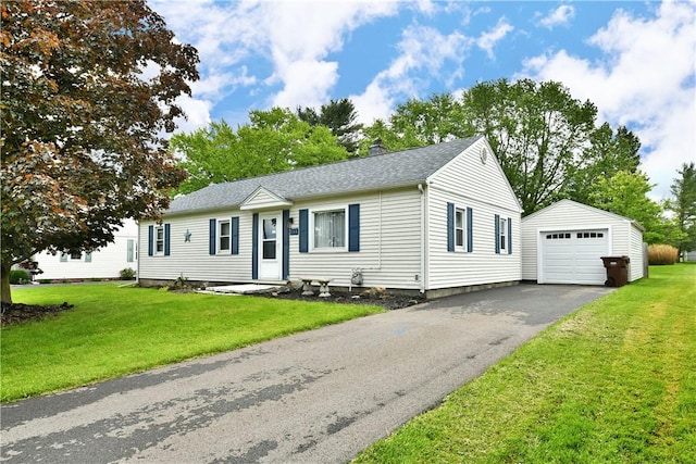 114 10th St, Pymatuning Twp, PA 16125 - ranch-style home with an outbuilding, driveway, a front yard, roof with shingles, and a garage