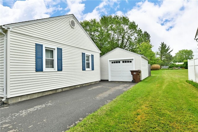 114 10th St, Pymatuning Twp, PA 16125 - view of home's exterior with an outbuilding, driveway, a detached garage, and a yard