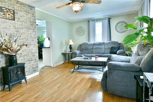 114 10th St, Pymatuning Twp, PA 16125 - living room featuring wood finished floors, a ceiling fan, ornamental molding, and a wood stove