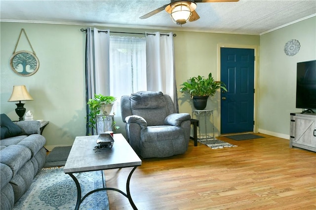 114 10th St, Pymatuning Twp, PA 16125 - living area with light wood-style floors, a ceiling fan, ornamental molding, and a textured ceiling