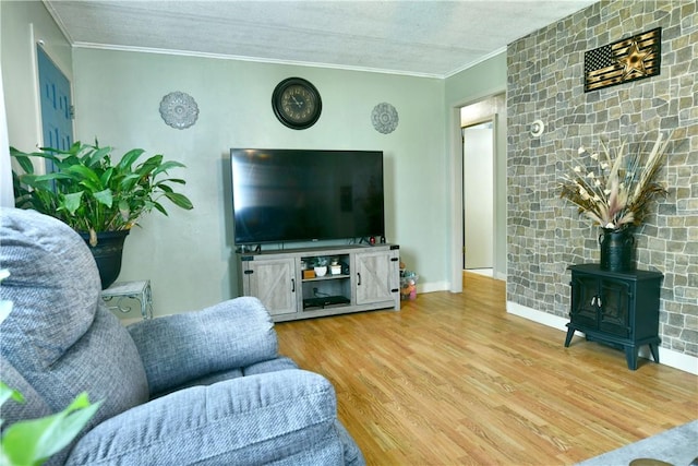114 10th St, Pymatuning Twp, PA 16125 - living area with a wood stove, wood finished floors, and ornamental molding