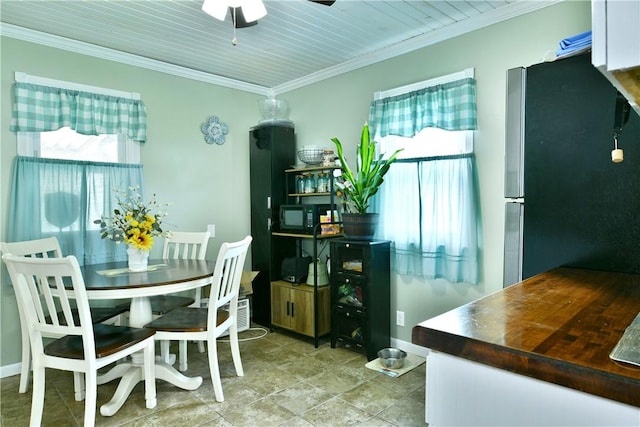 114 10th St, Pymatuning Twp, PA 16125 - dining area featuring ceiling fan, crown molding, and stone finish floors