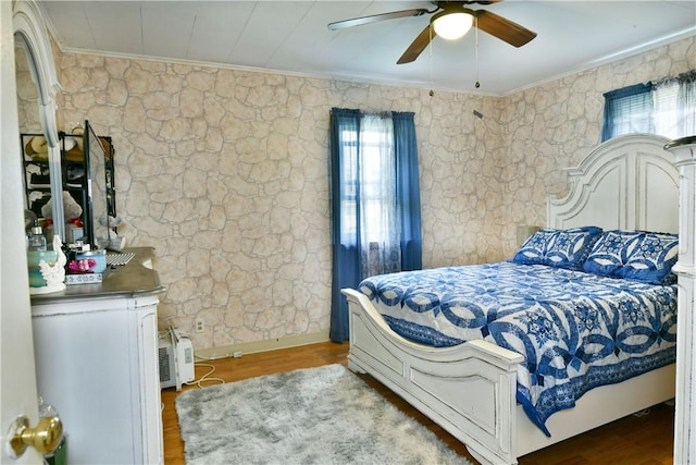 114 10th St, Pymatuning Twp, PA 16125 - bedroom featuring crown molding, multiple windows, wood finished floors, and a ceiling fan