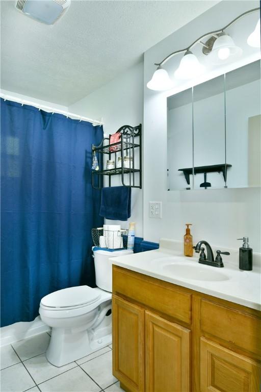 114 10th St, Pymatuning Twp, PA 16125 - full bathroom featuring vanity, tile patterned floors, curtained shower, and a textured ceiling