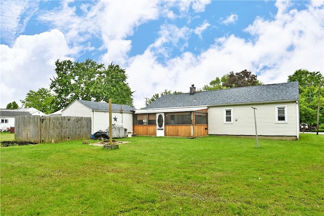114 10th St, Pymatuning Twp, PA 16125 - back of house featuring a sunroom and a chimney
