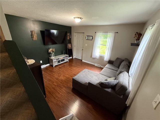 180 Beale Rd, Buffalo Twp, PA 16055 - living area with dark wood-type flooring and a textured ceiling