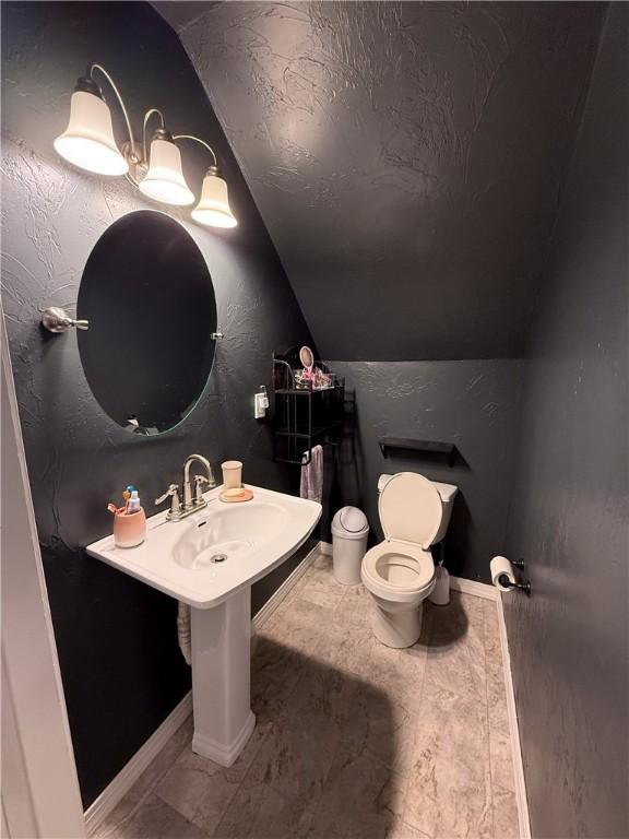 180 Beale Rd, Buffalo Twp, PA 16055 - bathroom with lofted ceiling and toilet