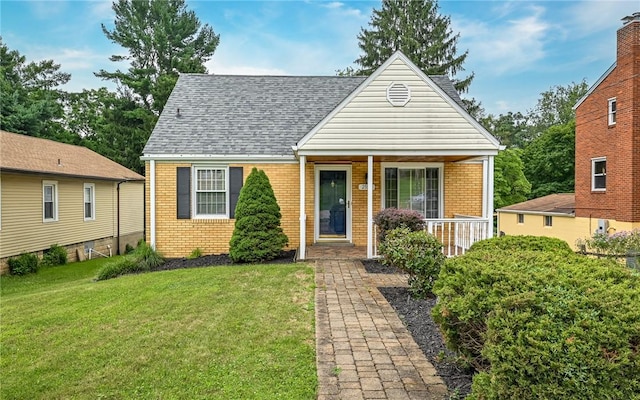 2514 Oakwood Rd, Shaler, PA 15116 - view of front of property with brick siding, a front yard, a porch, and a shingled roof
