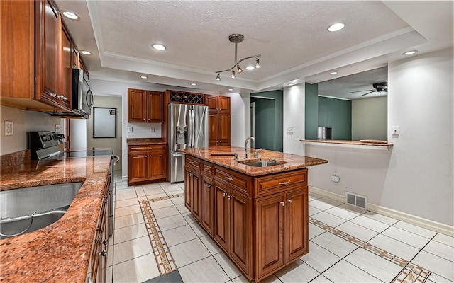 2514 Oakwood Rd, Shaler, PA 15116 - kitchen featuring appliances with stainless steel finishes, a tray ceiling, light tile patterned floors, inlaid floor details, and recessed lighting