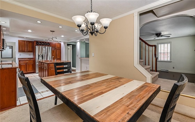 2514 Oakwood Rd, Shaler, PA 15116 - dining area featuring crown molding, a tray ceiling, a chandelier, stairs, and a ceiling fan