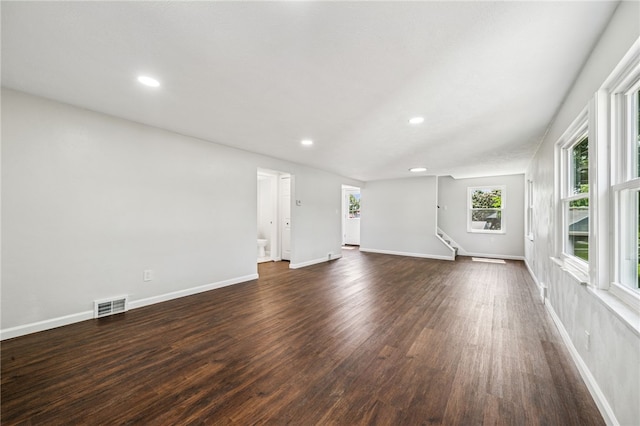 1611 Guffey Rd, North Huntingdon, PA 15642 - unfurnished living room with dark wood-style floors, recessed lighting, and stairs