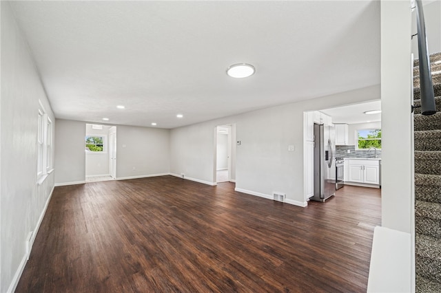 1611 Guffey Rd, North Huntingdon, PA 15642 - unfurnished living room featuring stairway, dark wood-style floors, and recessed lighting