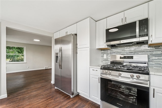 1611 Guffey Rd, North Huntingdon, PA 15642 - kitchen featuring stainless steel appliances, dark wood-style floors, backsplash, and white cabinets