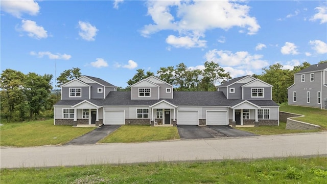 2215 Lebanon Dr, Elizabeth Twp/Boro, PA 15135 - traditional-style home with asphalt driveway, stone siding, a front yard, and a garage
