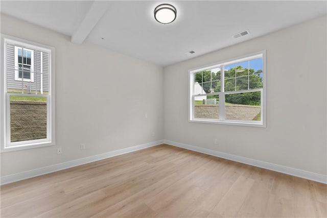 2215 Lebanon Dr, Elizabeth Twp/Boro, PA 15135 - empty room with light wood-type flooring and beam ceiling