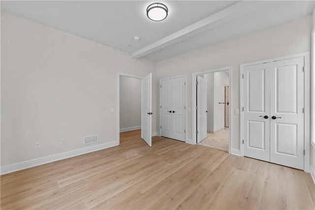 2215 Lebanon Dr, Elizabeth Twp/Boro, PA 15135 - unfurnished bedroom with two closets and light wood-style flooring