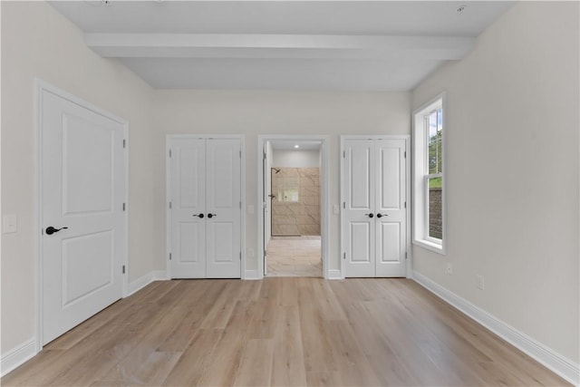 2215 Lebanon Dr, Elizabeth Twp/Boro, PA 15135 - unfurnished bedroom with beam ceiling, light wood finished floors, multiple closets, and ensuite bathroom