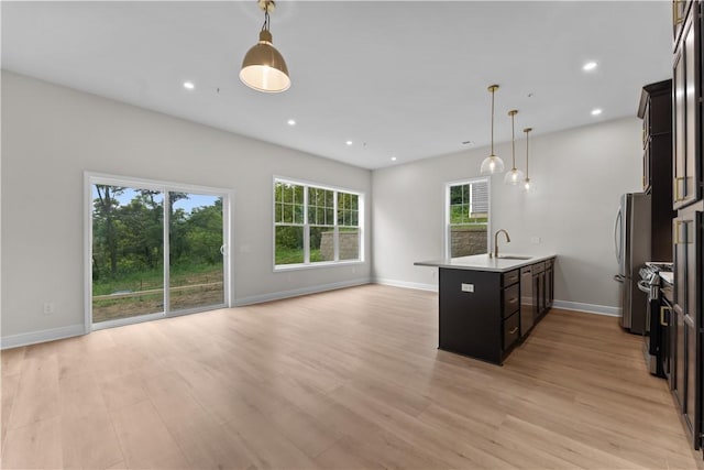 2215 Lebanon Dr, Elizabeth Twp/Boro, PA 15135 - kitchen with open floor plan, a peninsula, light wood finished floors, decorative light fixtures, and recessed lighting
