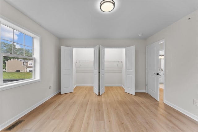 2215 Lebanon Dr, Elizabeth Twp/Boro, PA 15135 - unfurnished bedroom featuring multiple closets and light wood-type flooring