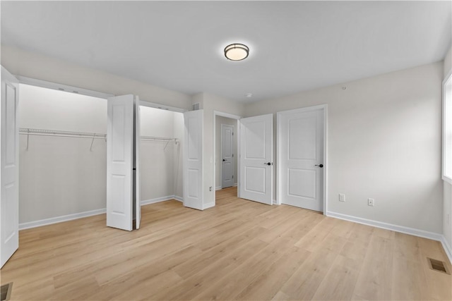 2215 Lebanon Dr, Elizabeth Twp/Boro, PA 15135 - unfurnished bedroom featuring light wood-style floors and multiple closets