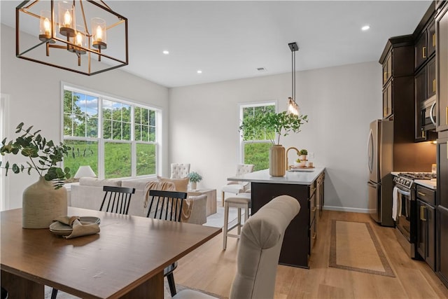 2219 Lebanon Dr, Elizabeth Twp/Boro, PA 15135 - dining area featuring light wood-type flooring, plenty of natural light, a chandelier, and recessed lighting