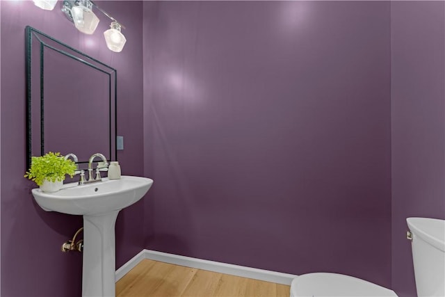 2219 Lebanon Dr, Elizabeth Twp/Boro, PA 15135 - half bathroom featuring toilet and wood finished floors