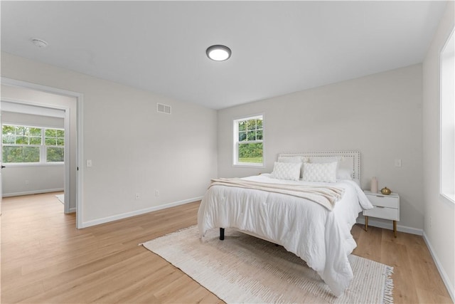 2219 Lebanon Dr, Elizabeth Twp/Boro, PA 15135 - bedroom featuring light wood-style flooring and multiple windows