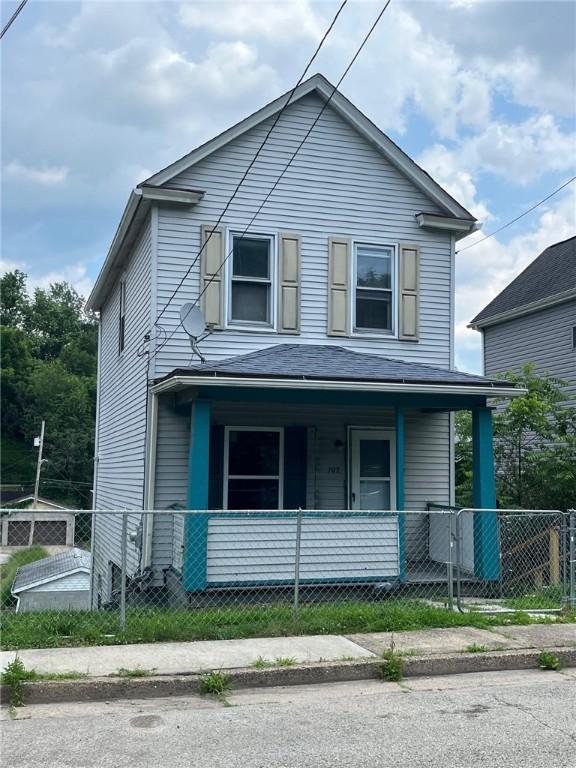 702 Sellers Ave, Jeannette, PA 15644 - view of front of property with covered porch and a fenced front yard