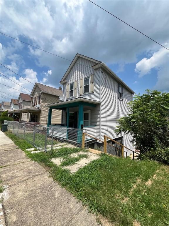 702 Sellers Ave, Jeannette, PA 15644 - view of front of house with a porch