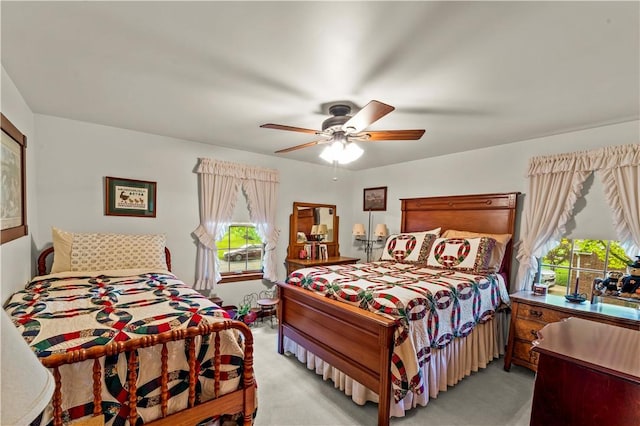 44 Stonehenge Dr, South Strabane, PA 15301 - bedroom with multiple windows, light colored carpet, and ceiling fan